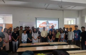 शूलिनी विश्वविद्यालय ने राष्ट्रीय अंतरिक्ष दिवस मनाया "Group photo of students and faculty at Shoolini University celebrating National Space Day 2025 with a presentation in the background."